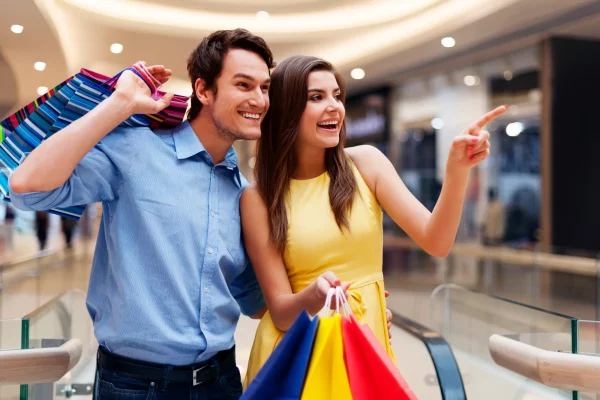 woman-showing-something-shopping-mall